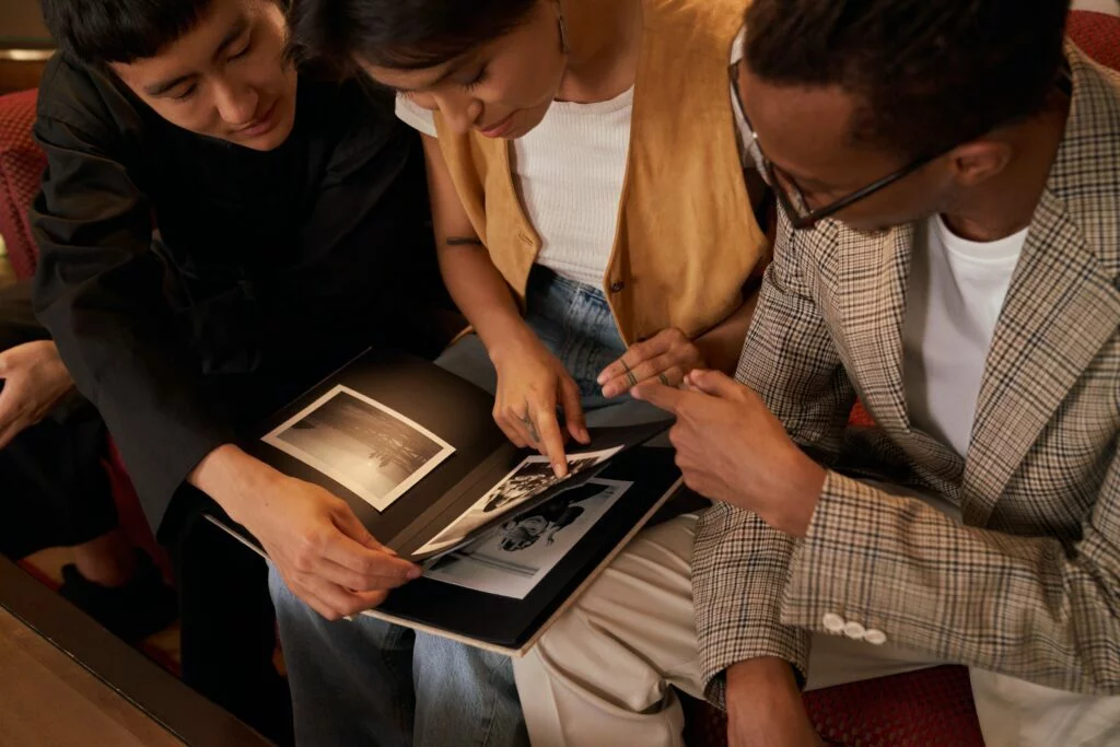 Adult sibling is watching photos from childhood