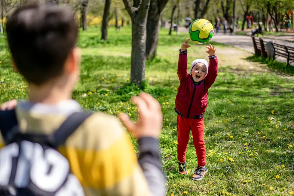 sibling playing outdoor games