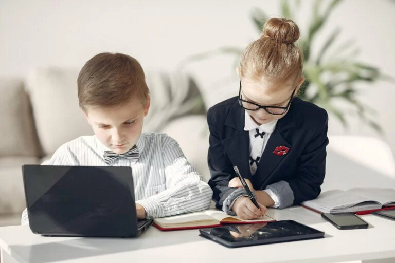 brother and sister are playing with interactive technology
