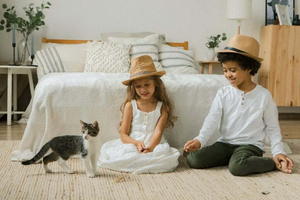 children with their pet cat