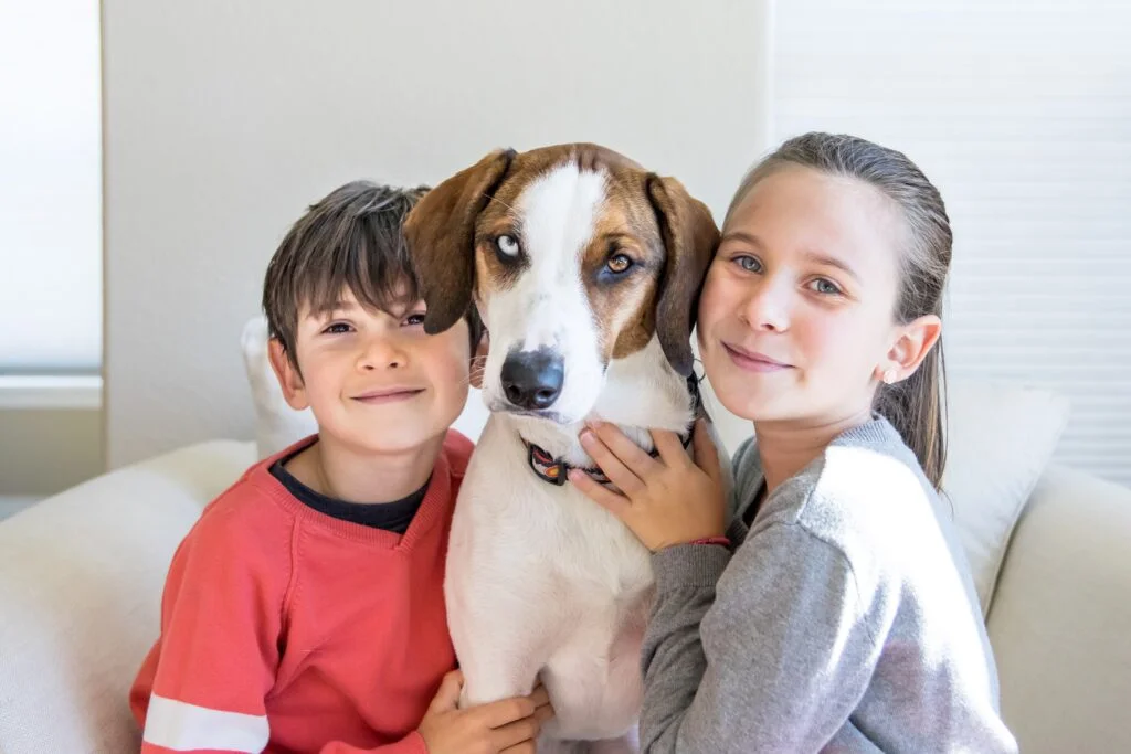 children with their pet dog